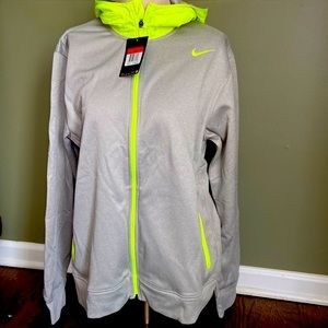 Mens Large Nike hooded jacket. New with tags. Neon details. Zippered front.